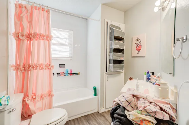 a bathroom with a sink toilet and bathtub