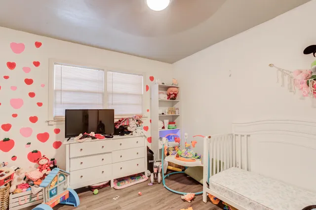 a room with furniture and flat screen tv