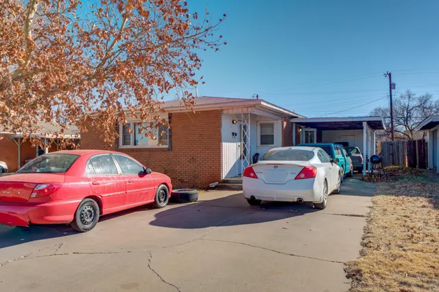 a front view of a house with parking space