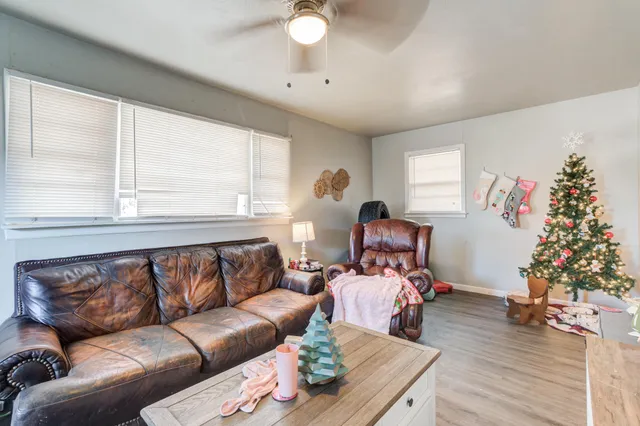 a living room with furniture and a window
