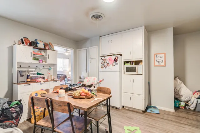a room with furniture a rug and a window