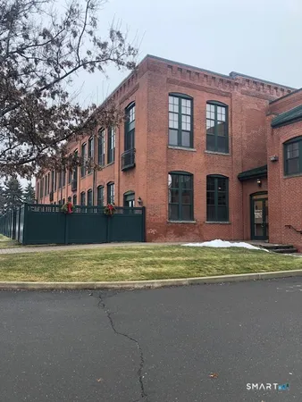 a view of a house with a swimming pool and a yard