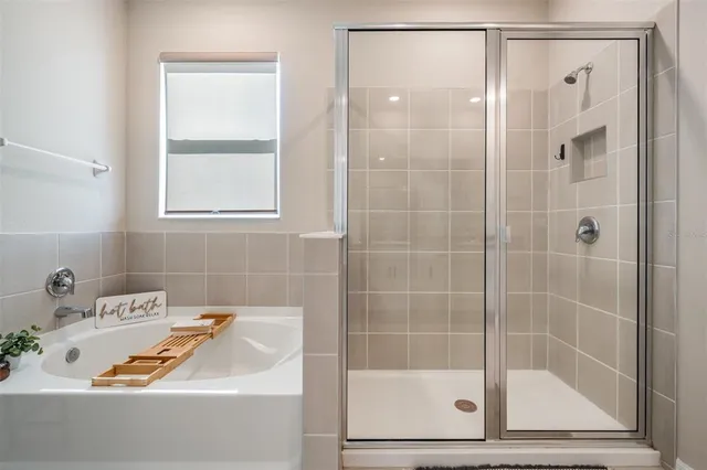 a bedroom with a bed and a chair