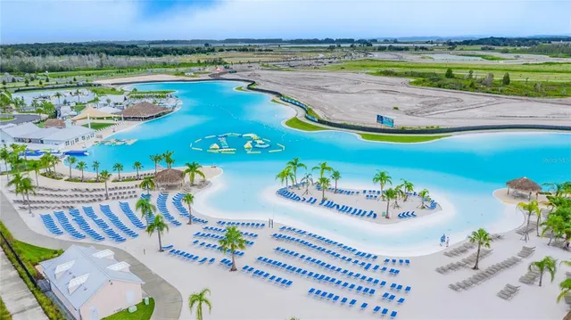 a view of a swimming pool with a table and chairs