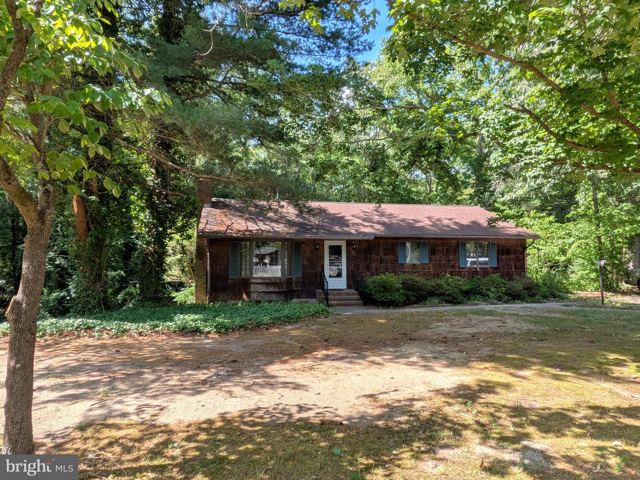 9683 Tharp Road Seaford, DE 19973 - Photo 2 of 41 Nestled among the trees.
