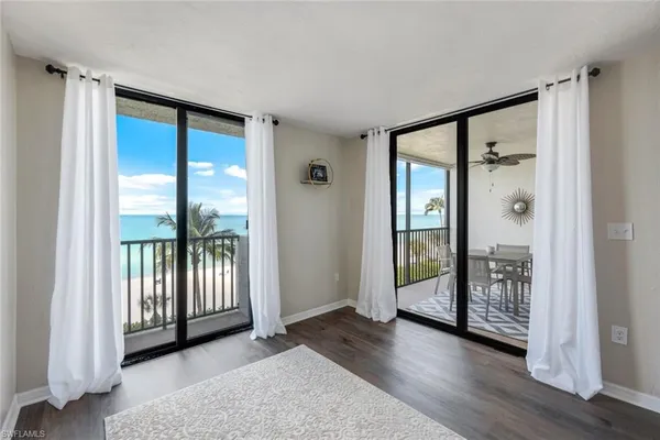 a view of an empty room with glass door