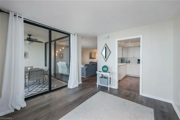 a bathroom with a glass door shower and a sink
