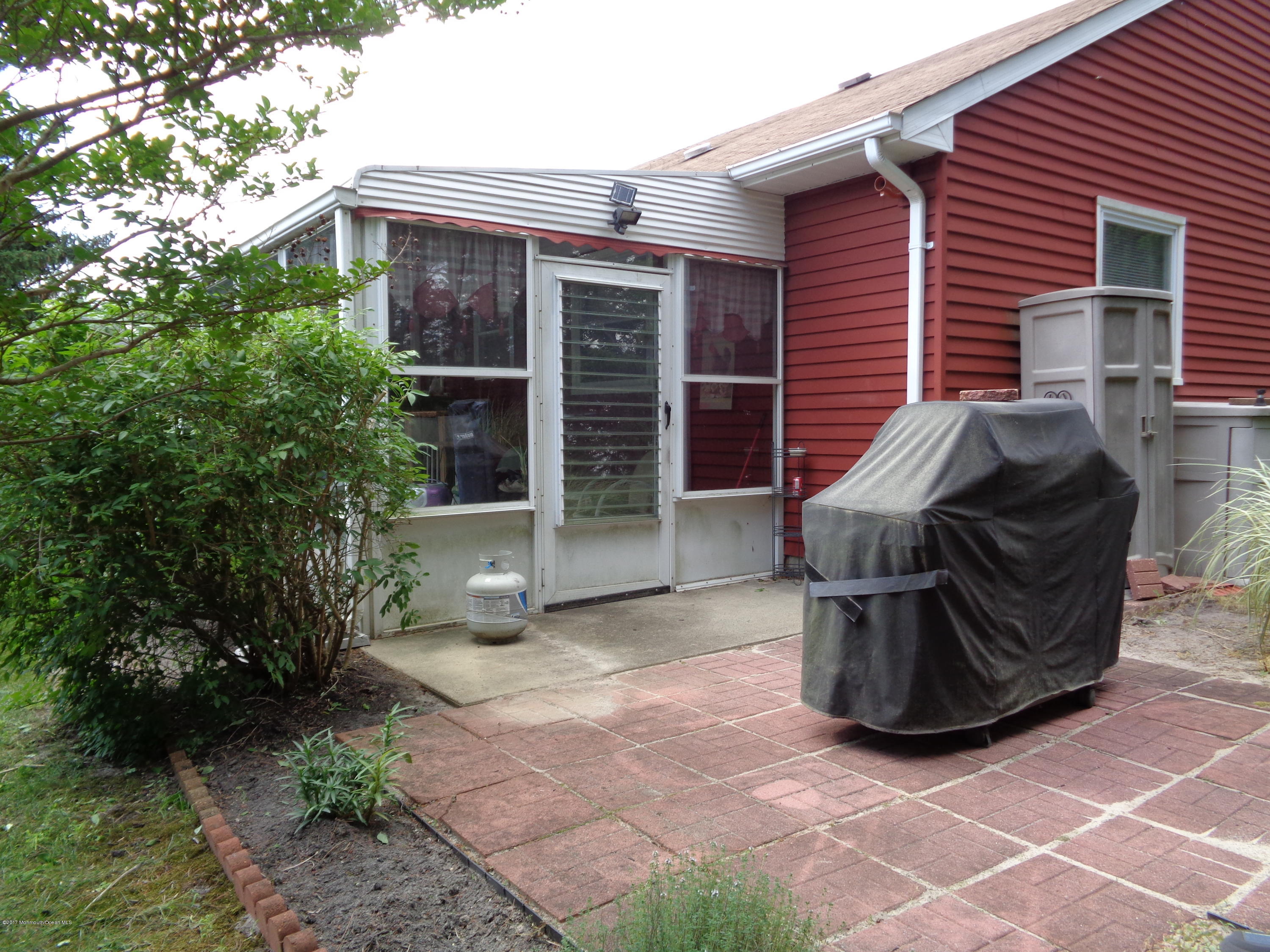 23 Ashley Road Whiting, NJ 08759 - Photo 5 of 21 a view of a patio with table and chairs and potted plants