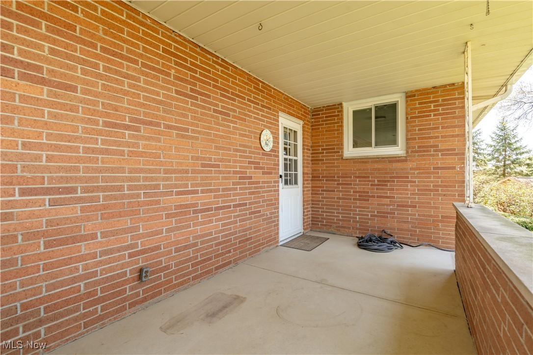 2045 Amherst Road Northeast Massillon, OH 44646 - Photo 34 of 39 Covered back porch perfect for relaxing with your morning coffee.