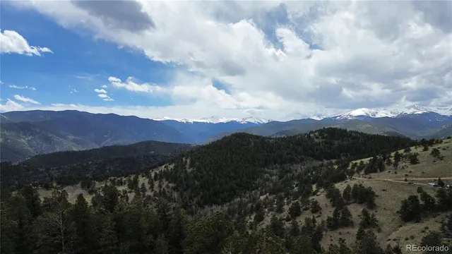 a view of mountains and valleys
