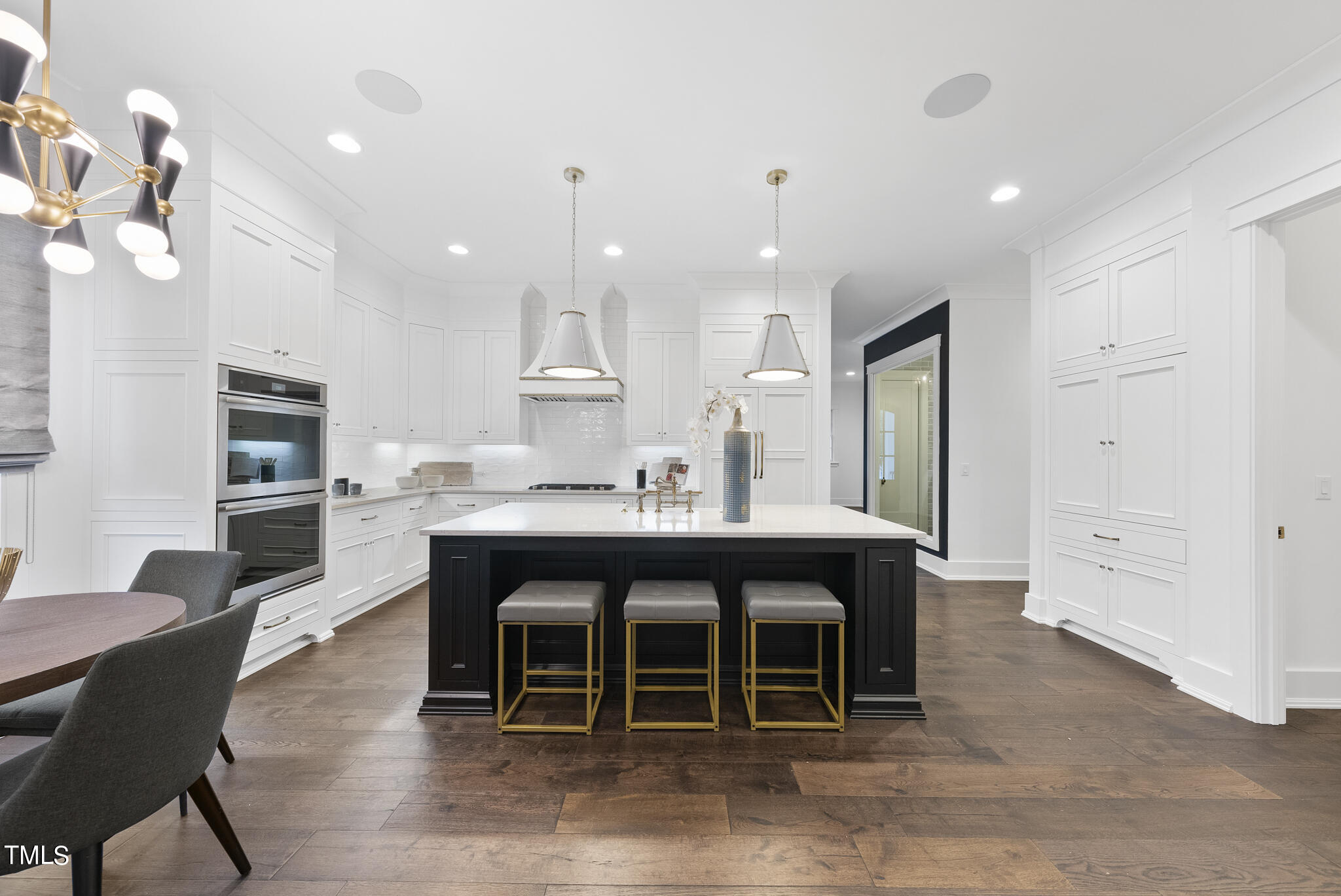 115 Edenburgh Road Raleigh, NC 27608 - Photo 13 of 50 a large kitchen with a table and chairs