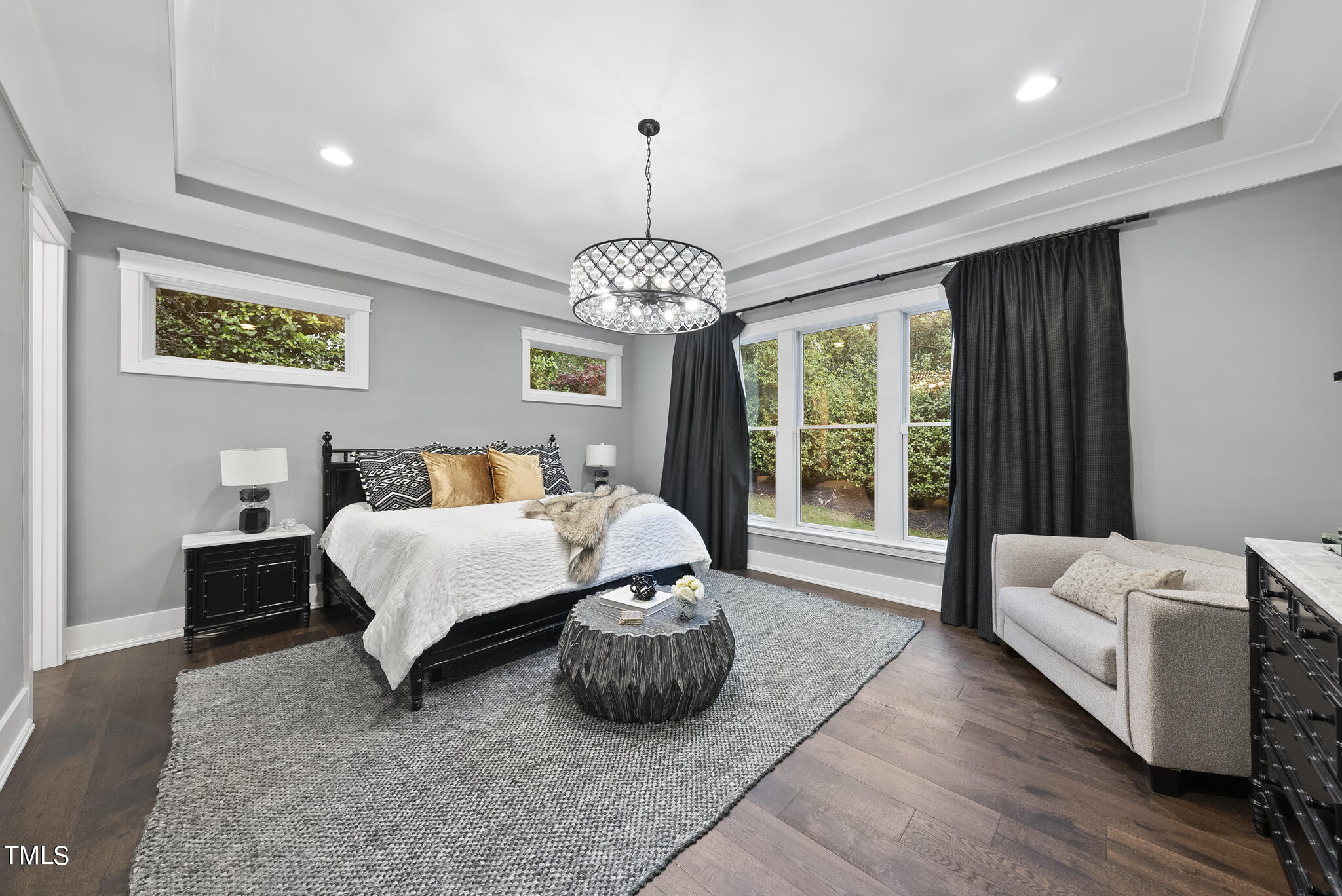 115 Edenburgh Road Raleigh, NC 27608 - Photo 21 of 50 a bedroom with a bed and wooden floor