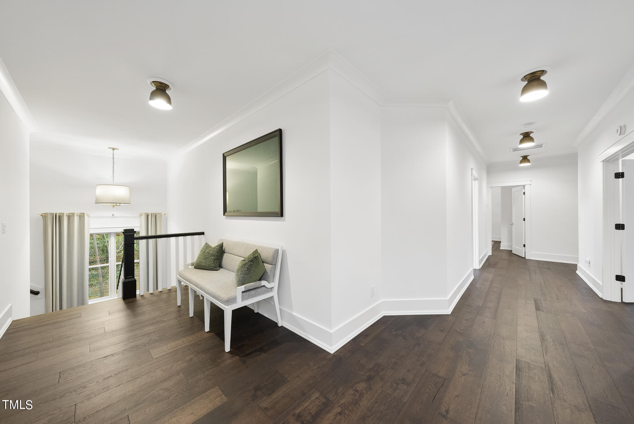 115 Edenburgh Road Raleigh, NC 27608 - Photo 35 of 50 a living room with furniture and a wooden floor