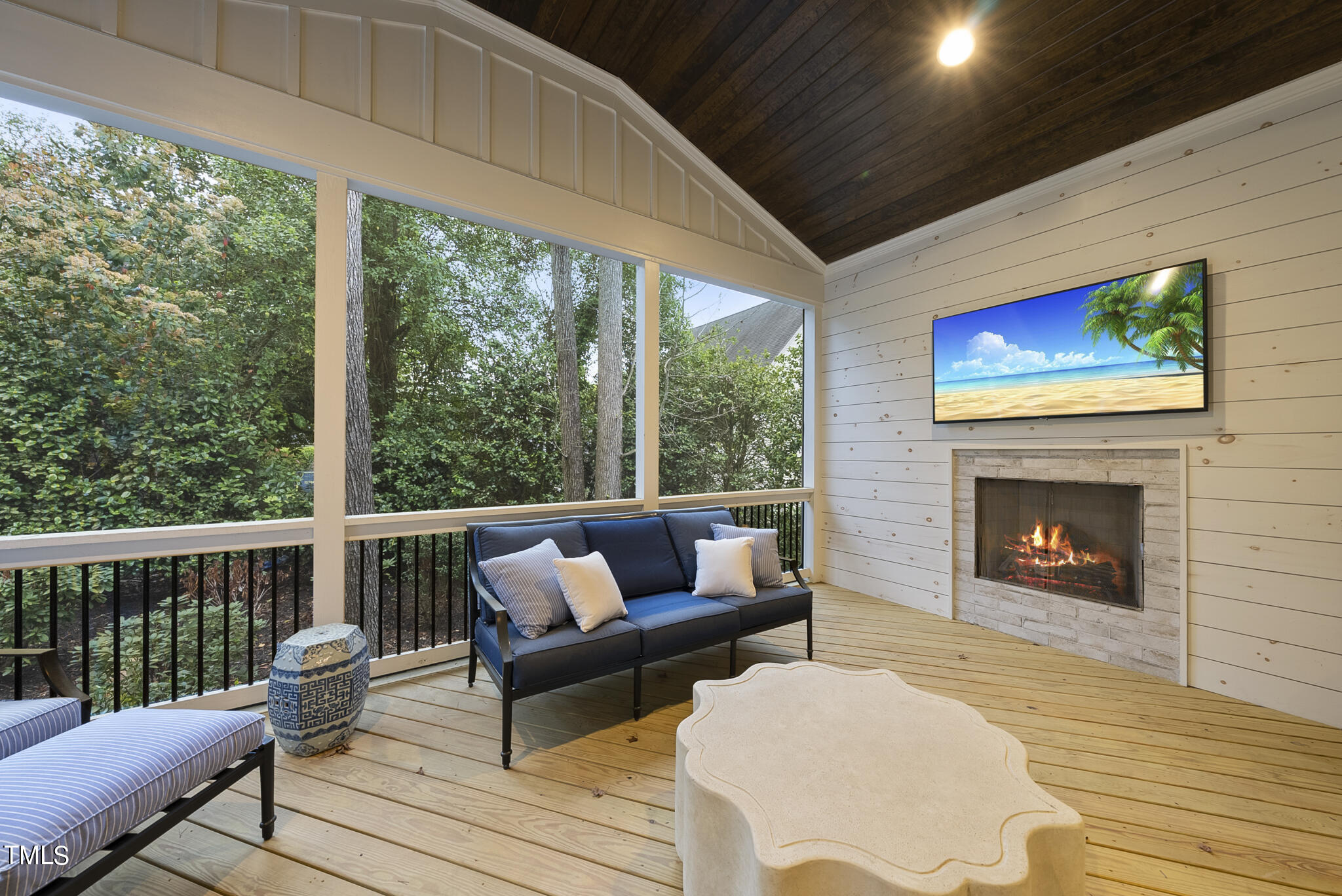 115 Edenburgh Road Raleigh, NC 27608 - Photo 46 of 50 a balcony with furniture and a fireplace