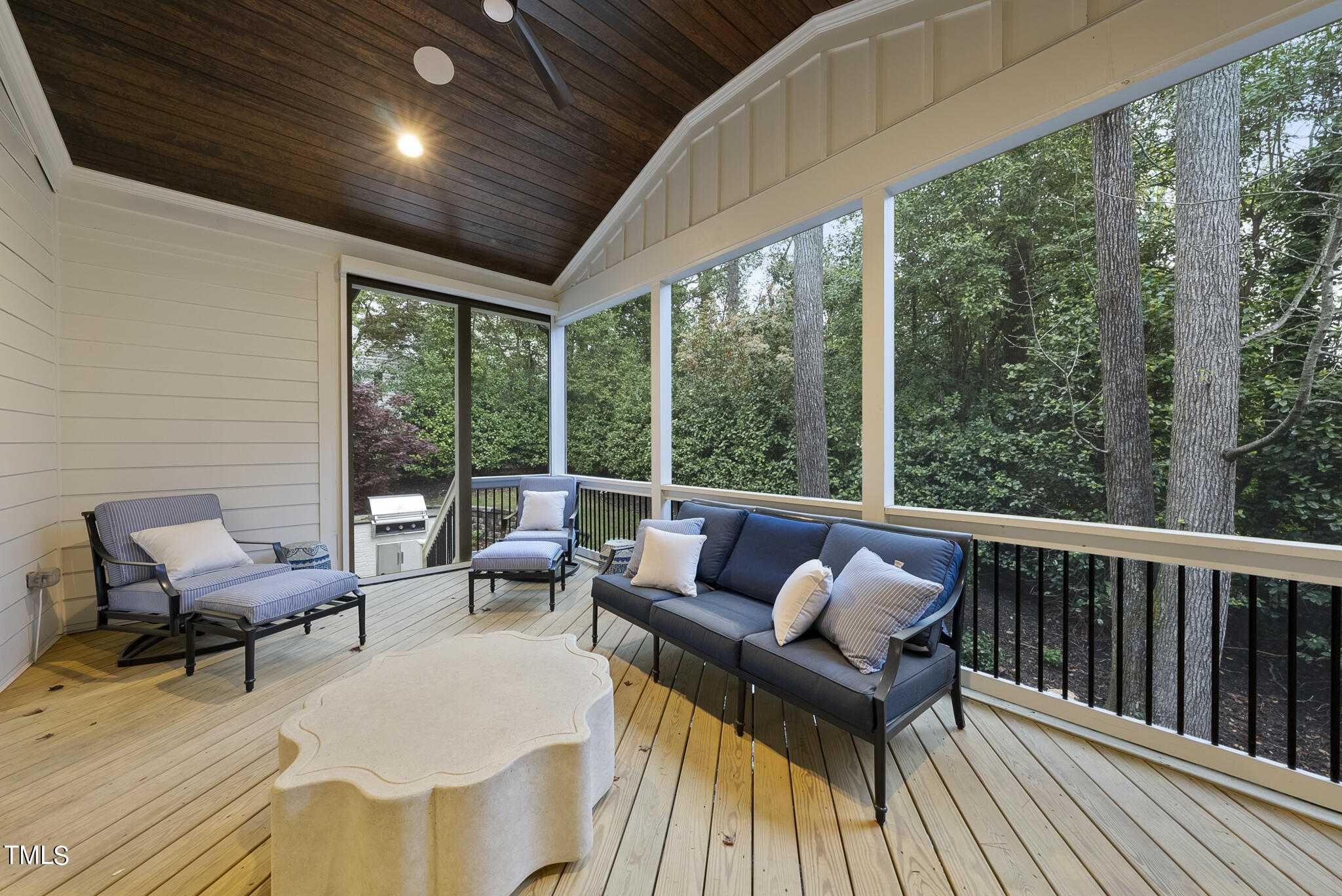 115 Edenburgh Road Raleigh, NC 27608 - Photo 47 of 50 a balcony with wooden benches and large windows