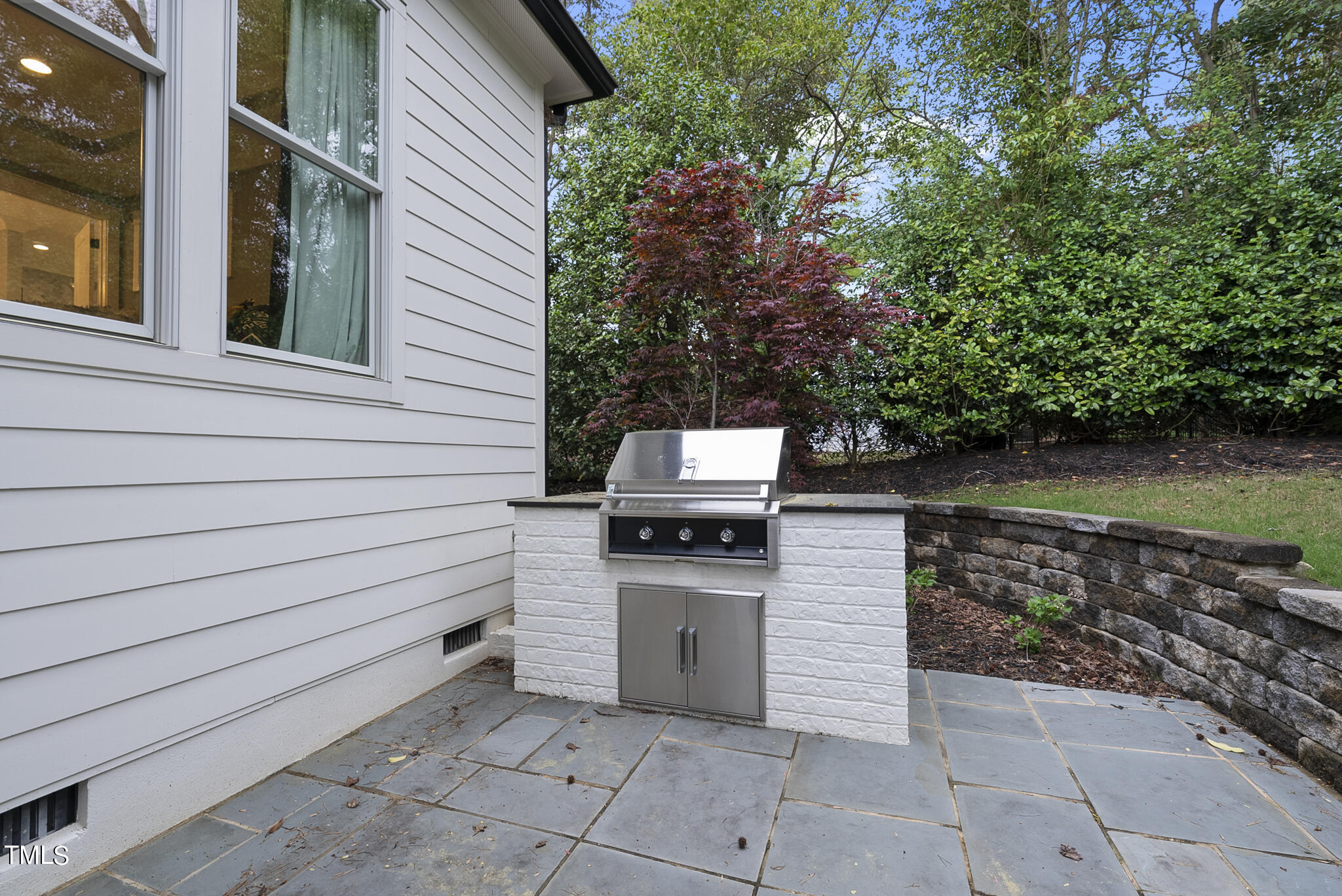 115 Edenburgh Road Raleigh, NC 27608 - Photo 48 of 50 a kitchen view with a stove and a bench