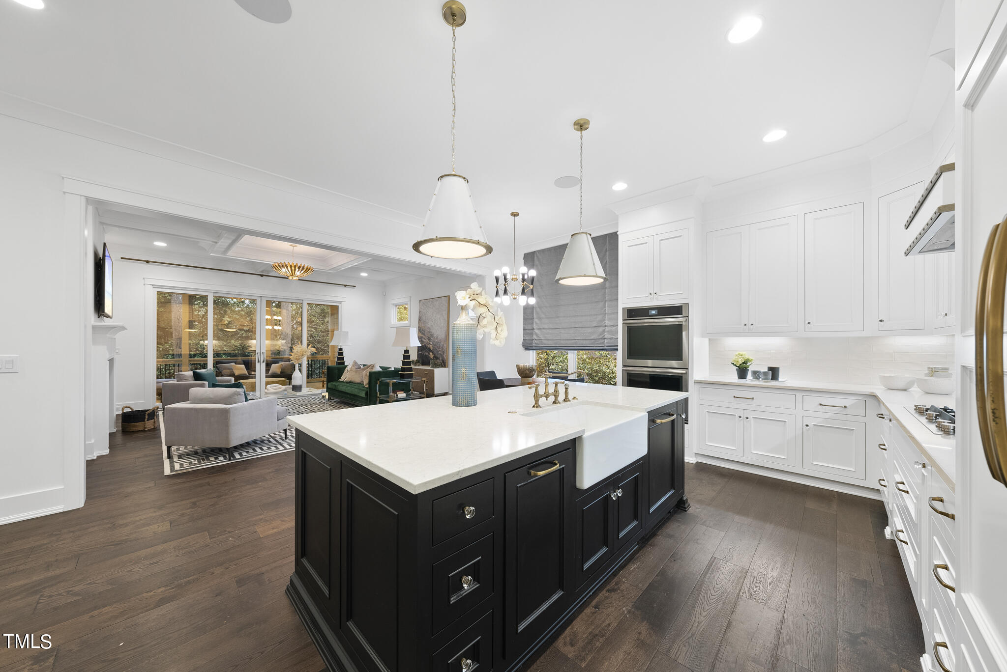 115 Edenburgh Road Raleigh, NC 27608 - Photo 10 of 50 a large kitchen with stainless steel appliances a lot of counter space and wooden floors