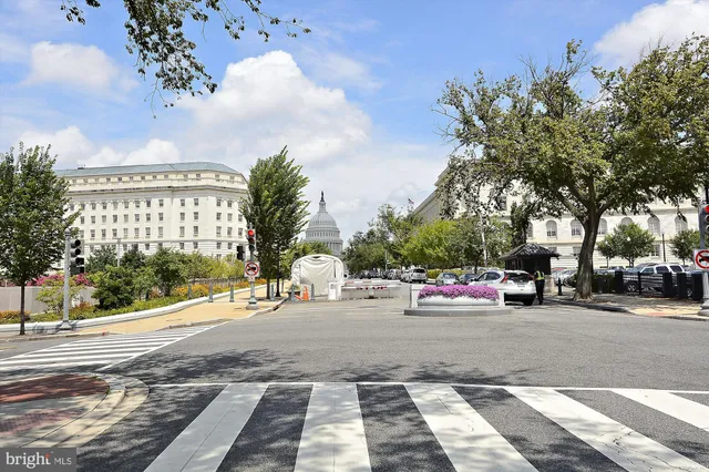 a view of a street with cars