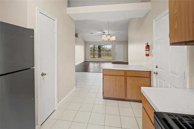 a kitchen with a sink and a refrigerator