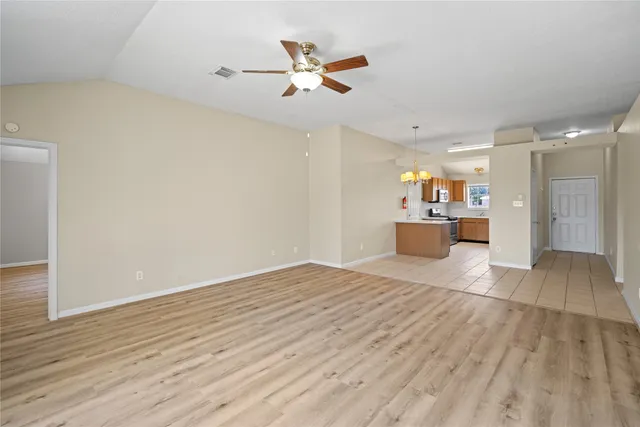 wooden floor in an empty room with a cabinet