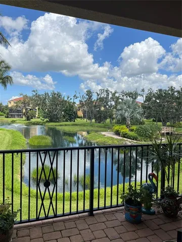 a view of staircase with lots of frames on wall