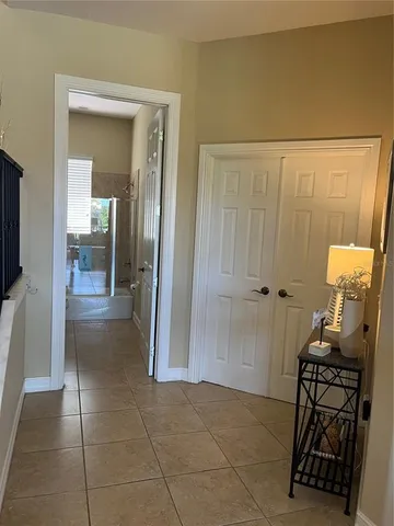 a bedroom with a large bed and a large window