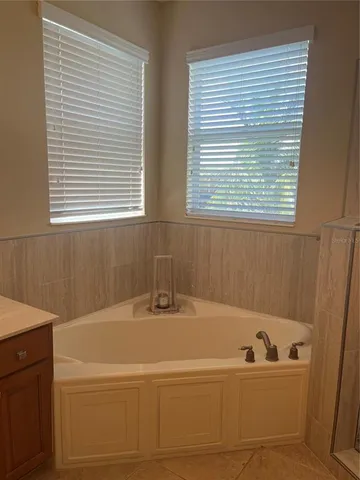 a bedroom with a bed and a desk