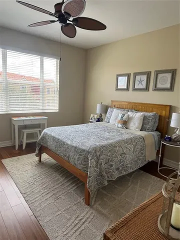 an aerial view of multiple houses with a yard