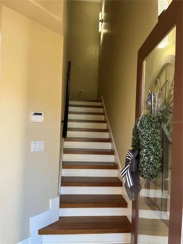 a kitchen with granite countertop a sink stove and refrigerator