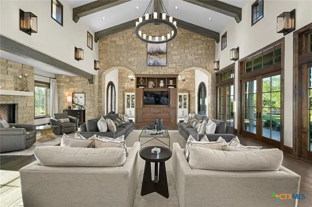 a large kitchen with a lot of cabinets and wooden floor
