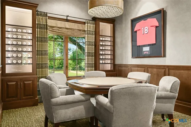 a spacious bedroom with a bed and a chandelier