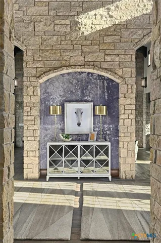 a large living room with stainless steel appliances