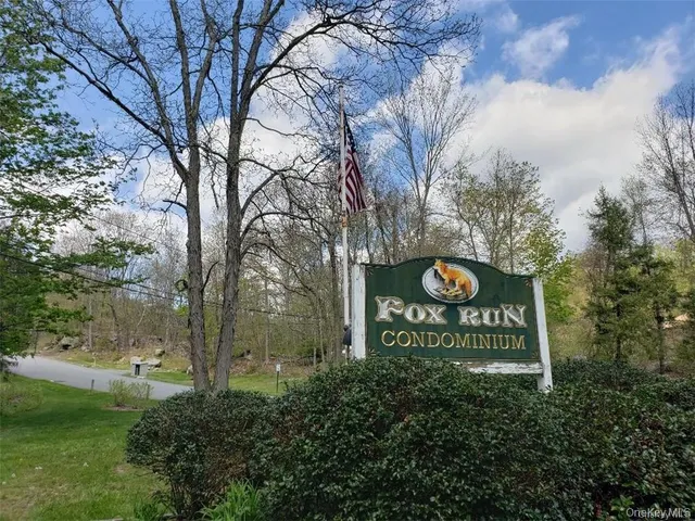 a view of outdoor space with sign board and garden