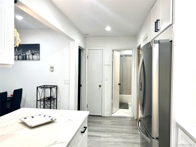 a large bedroom with a bed and a table