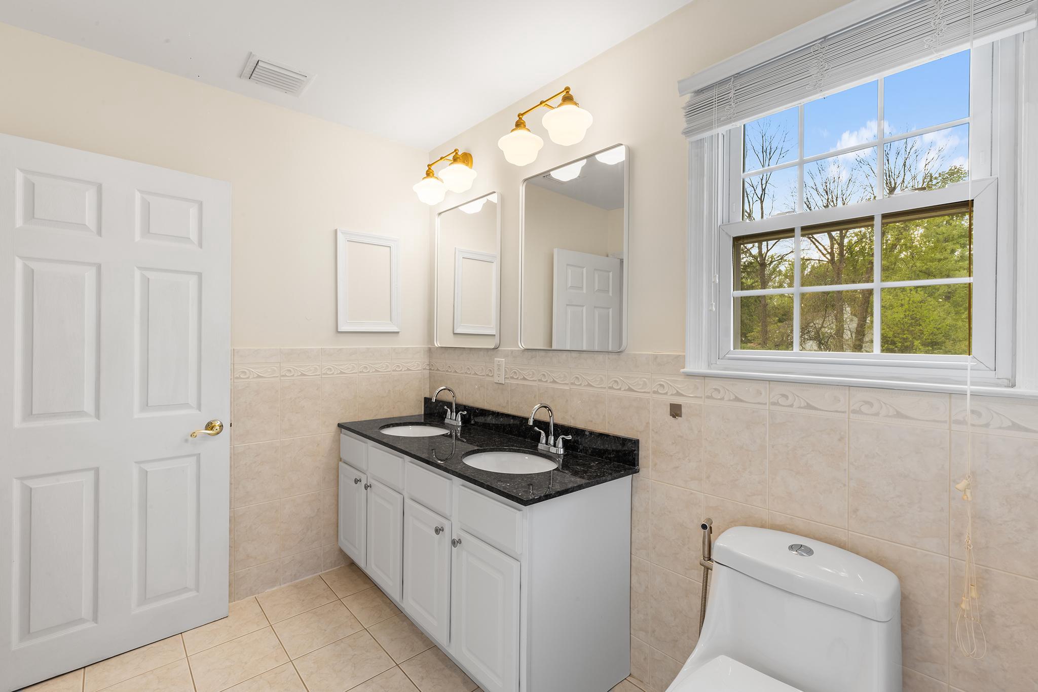 3503 St Davids Road Newtown Square, PA 19073 - Photo 32 of 45 a bathroom with a granite countertop sink and a mirror
