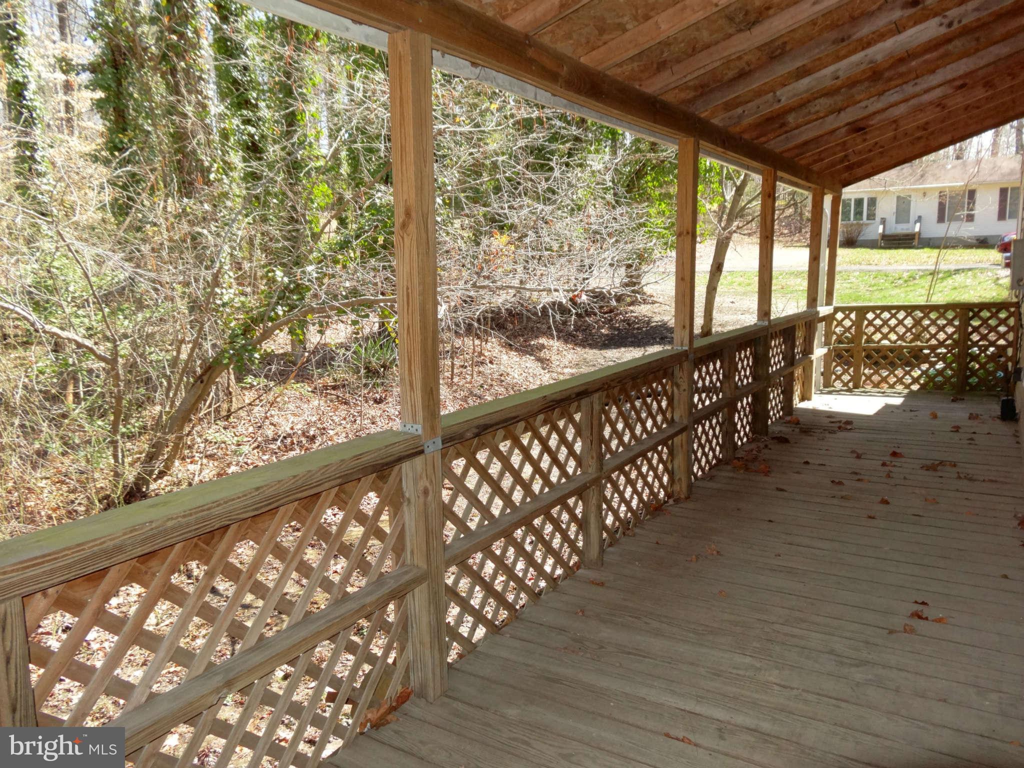340 Maverick Road Lusby, MD 20657 - Photo 14 of 21 Deck wraps around the side