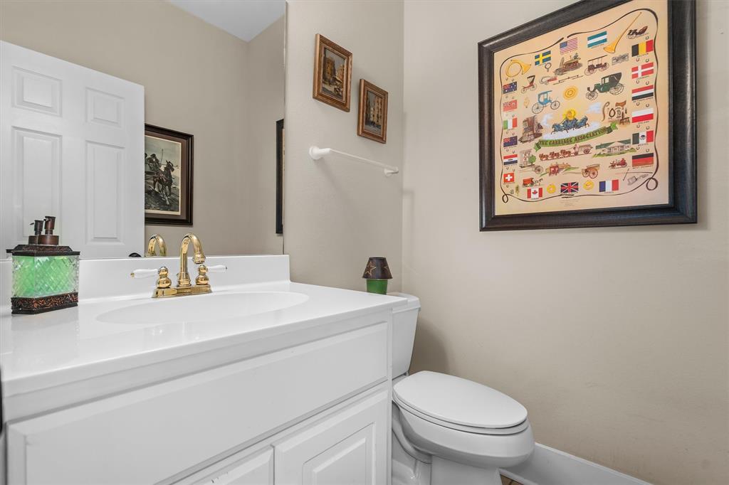 810 East Fm 321 Palestine, TX 75803 - Photo 15 of 40 a bathroom with a toilet a sink and a mirror
