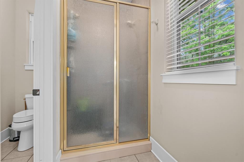810 East Fm 321 Palestine, TX 75803 - Photo 20 of 40 a bathroom with a glass shower door