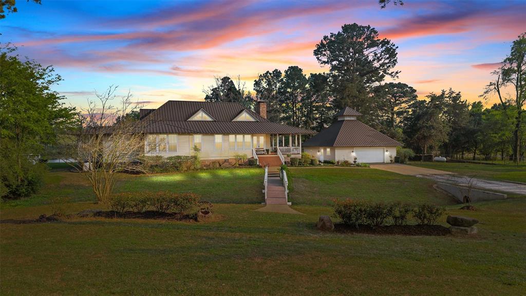 810 East Fm 321 Palestine, TX 75803 - Photo 2 of 40 a front view of a house with a garden