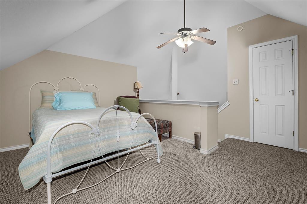 810 East Fm 321 Palestine, TX 75803 - Photo 28 of 40 a bedroom with a bed and a chandelier