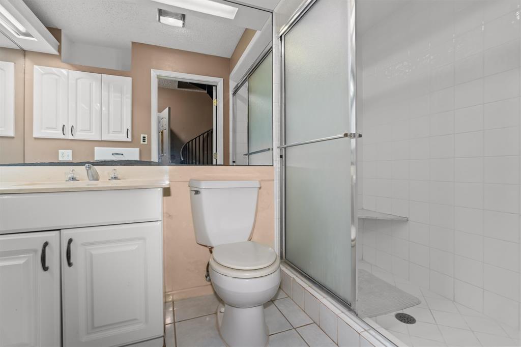 810 East Fm 321 Palestine, TX 75803 - Photo 33 of 40 a bathroom with a toilet a sink and shower