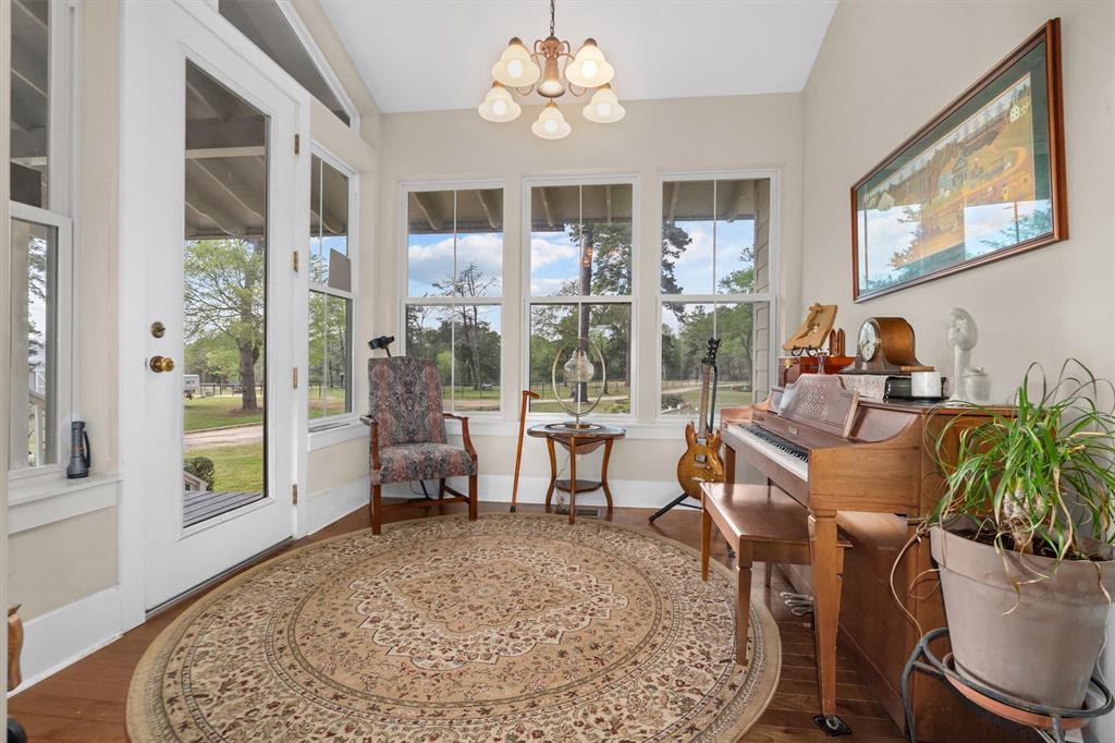 810 East Fm 321 Palestine, TX 75803 - Photo 8 of 40 a living room with furniture a chandelier and a large window