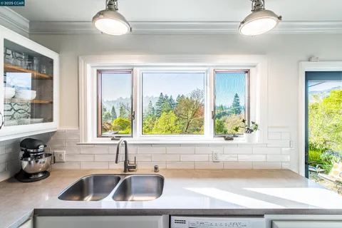 a kitchen with a sink and a window