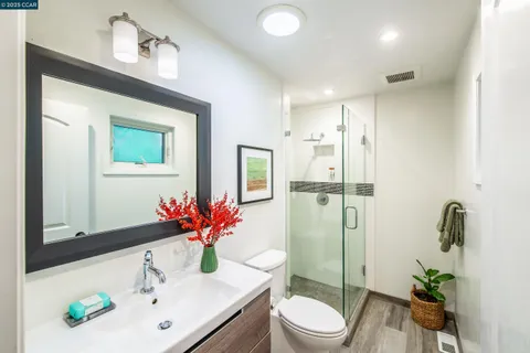 a bathroom with a toilet sink and shower