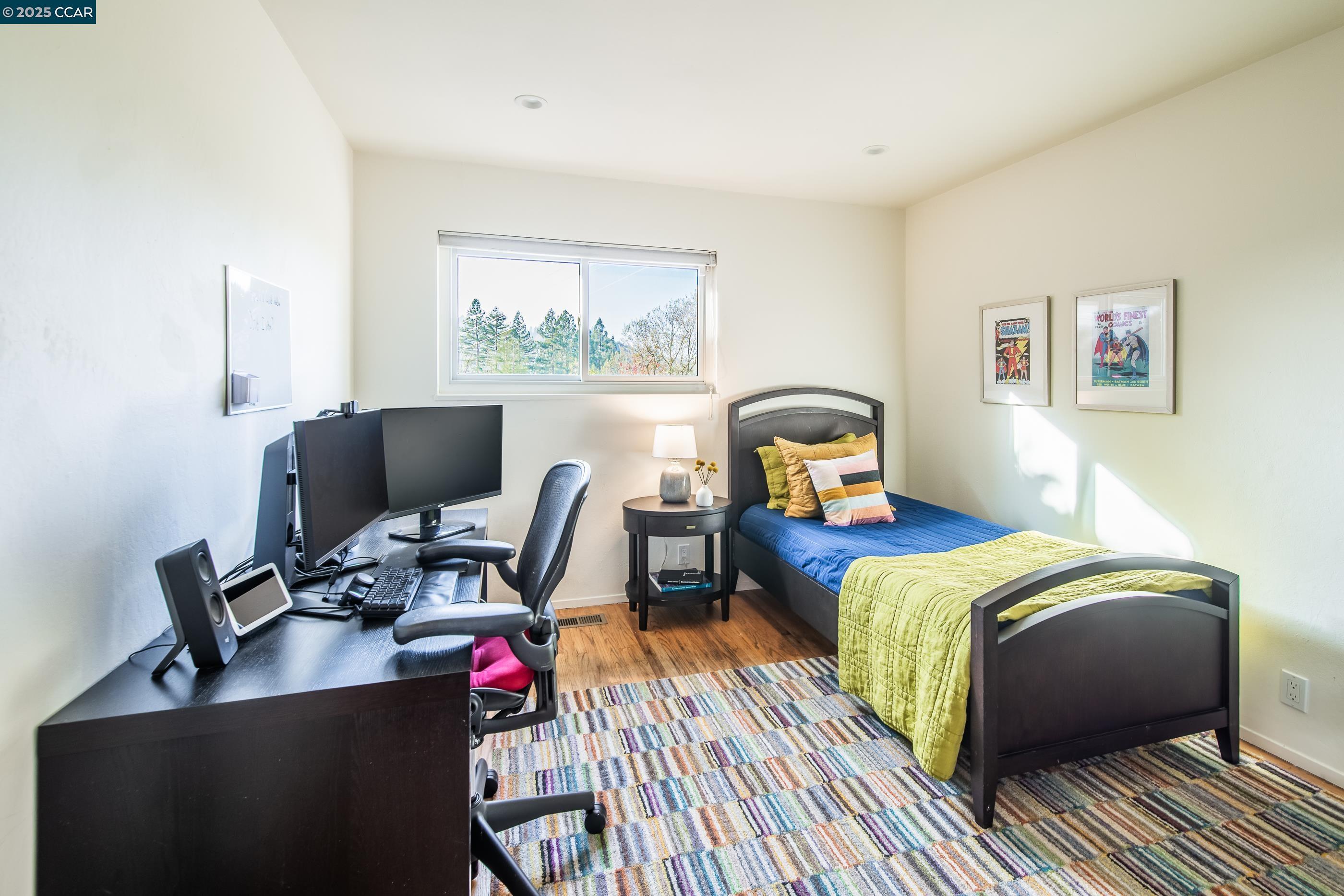 1085 Oak Hill Road, Unit D Lafayette, CA 94549 - Photo 27 of 35 a bedroom with a bed desk and a window
