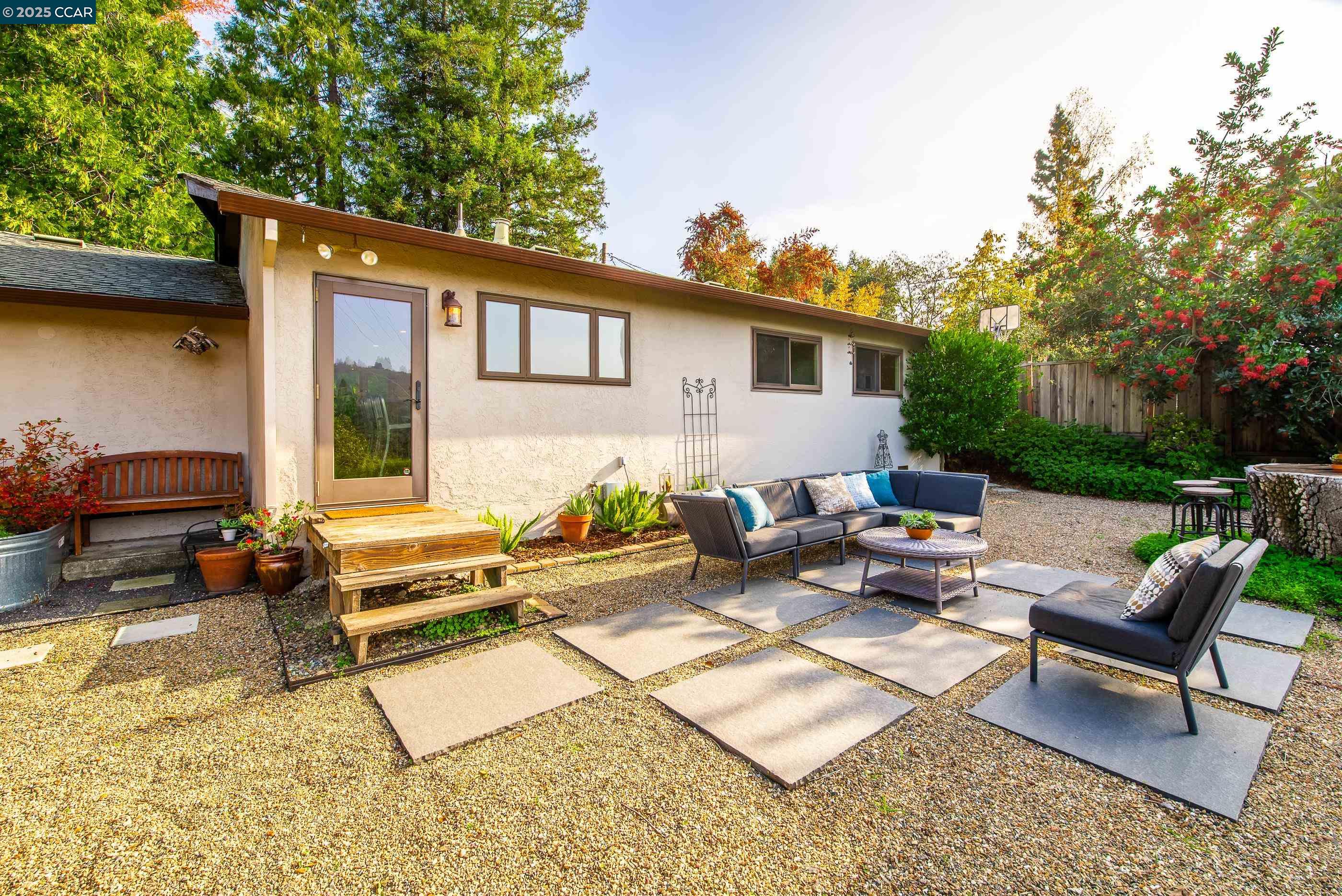 1085 Oak Hill Road, Unit D Lafayette, CA 94549 - Photo 30 of 35 a view of a house with backyard and sitting area