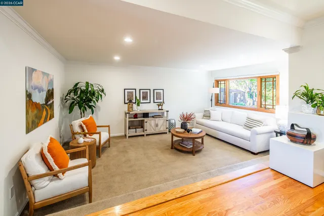 a dining room with furniture and wooden floor