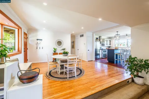 a kitchen with stainless steel appliances granite countertop a stove a refrigerator and a sink