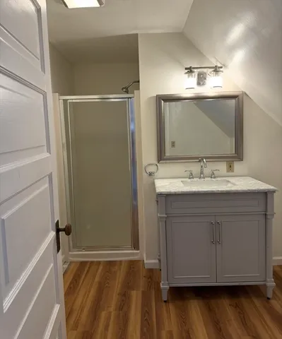 a bathroom with a sink vanity and mirror