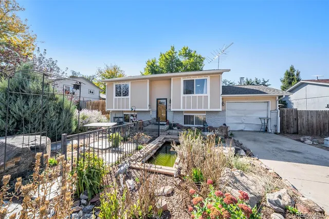 a view of house with swimming pool outdoor seating
